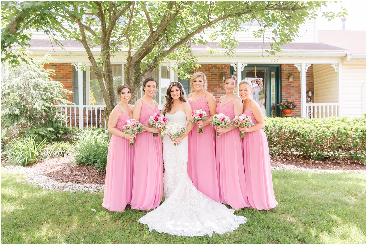 bridesmaids with bride on wedding day