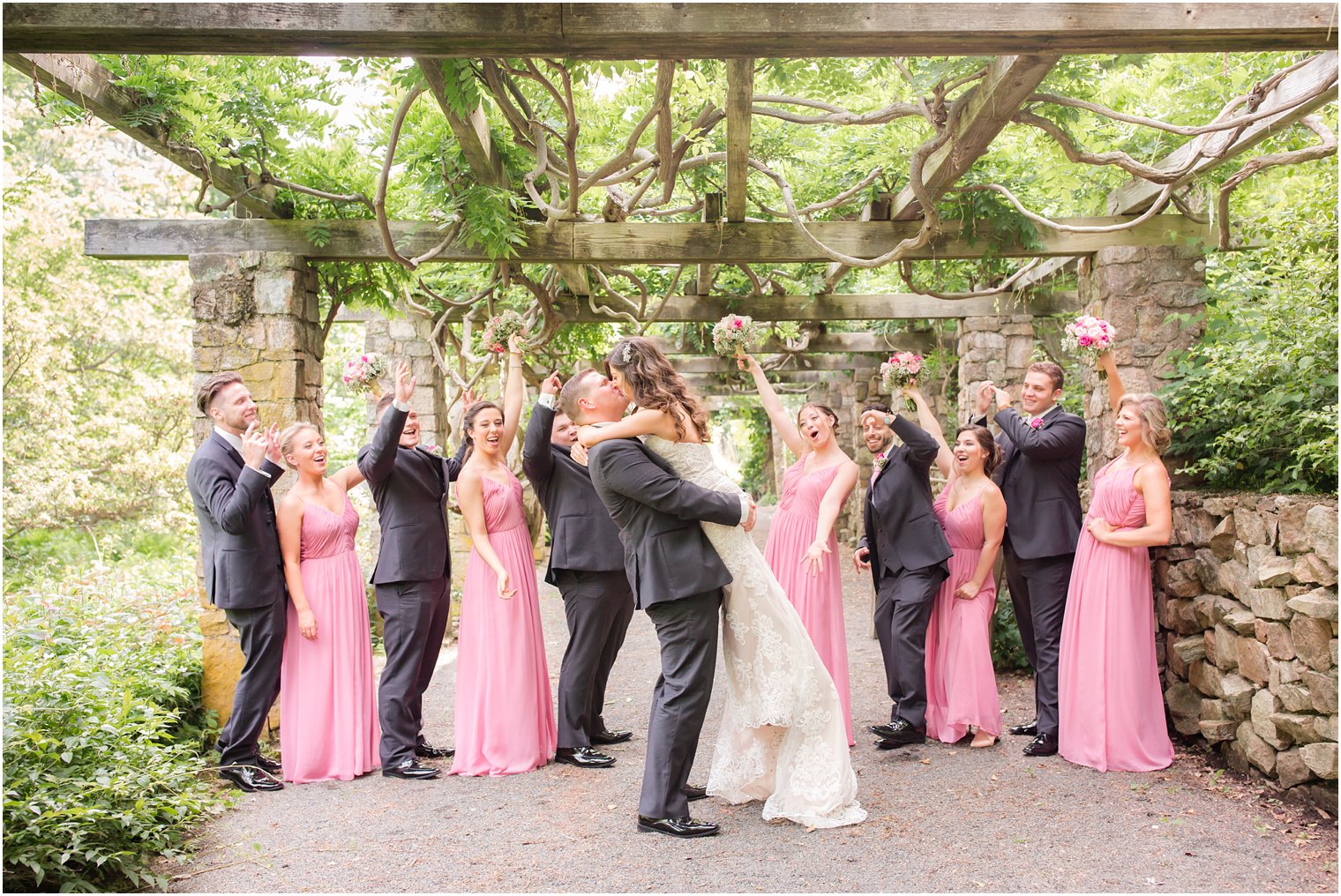 bridal party cheering for bride and groom