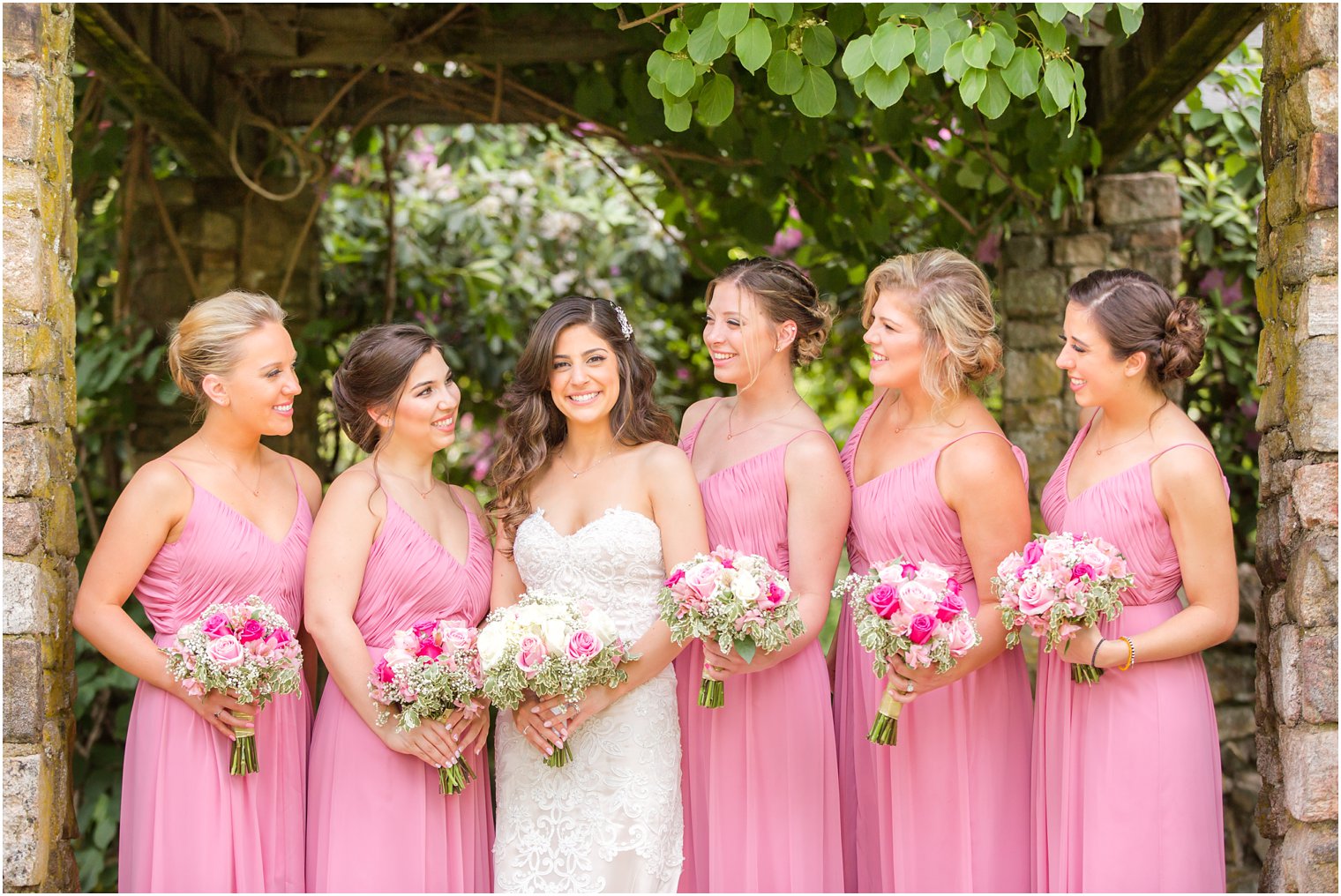 bridesmaids wearing pink dresses