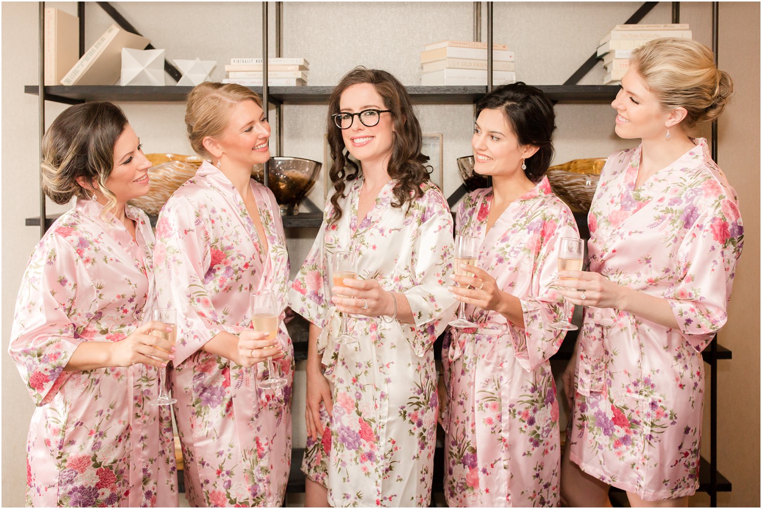 bride and bridesmaids in floral robes