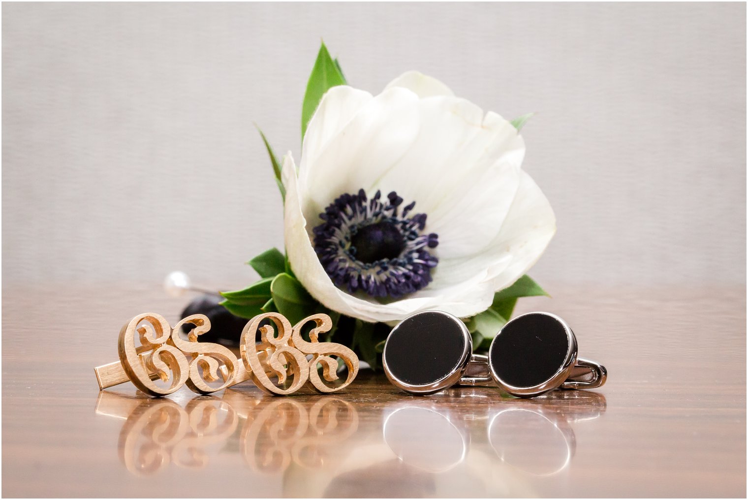 anemone boutonniere and cufflinks