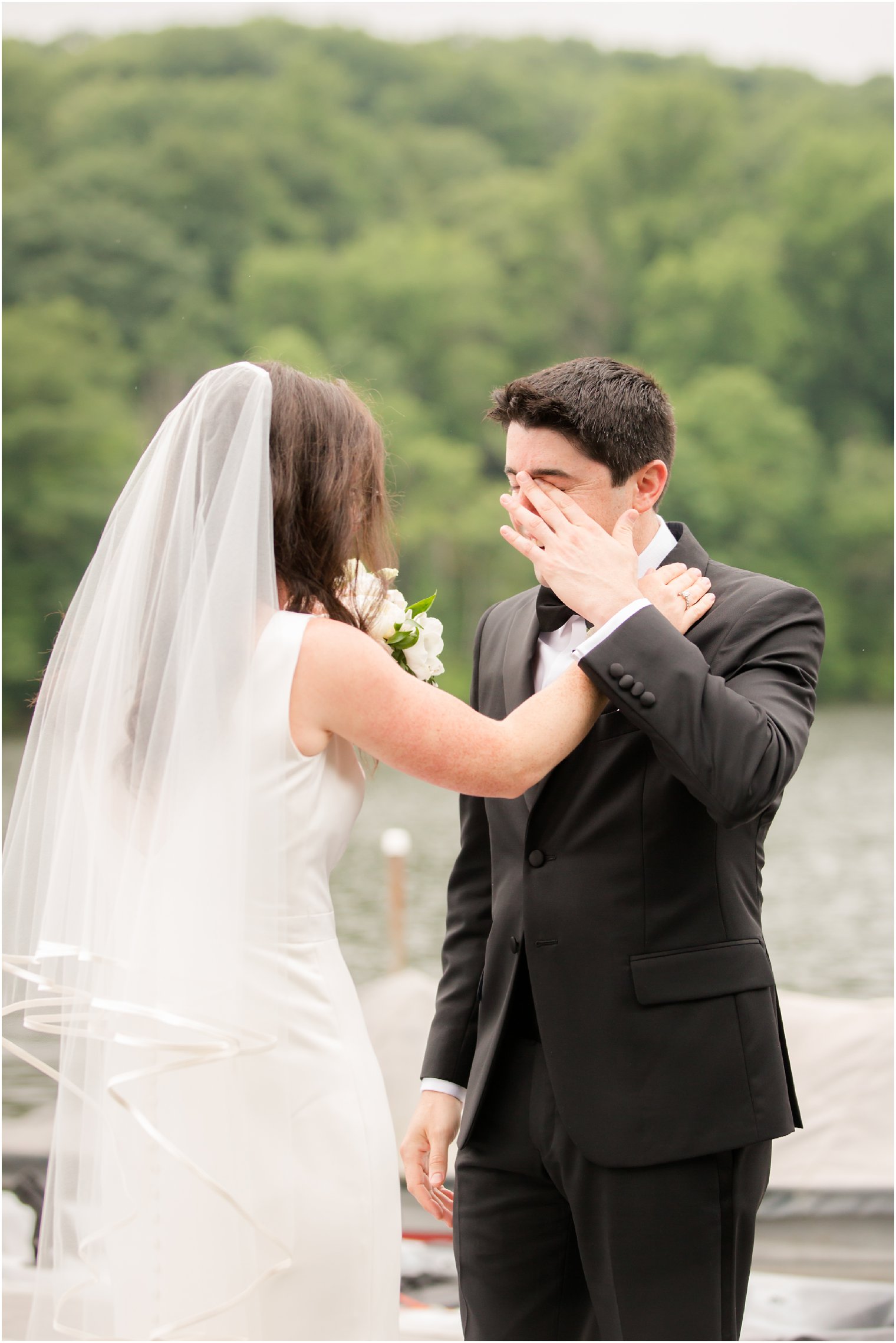 teary groom during first look