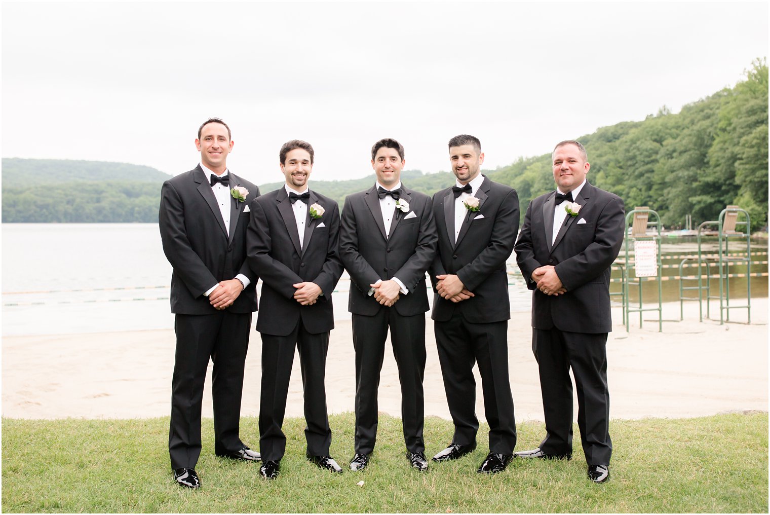 groomsmen in black tuxedos