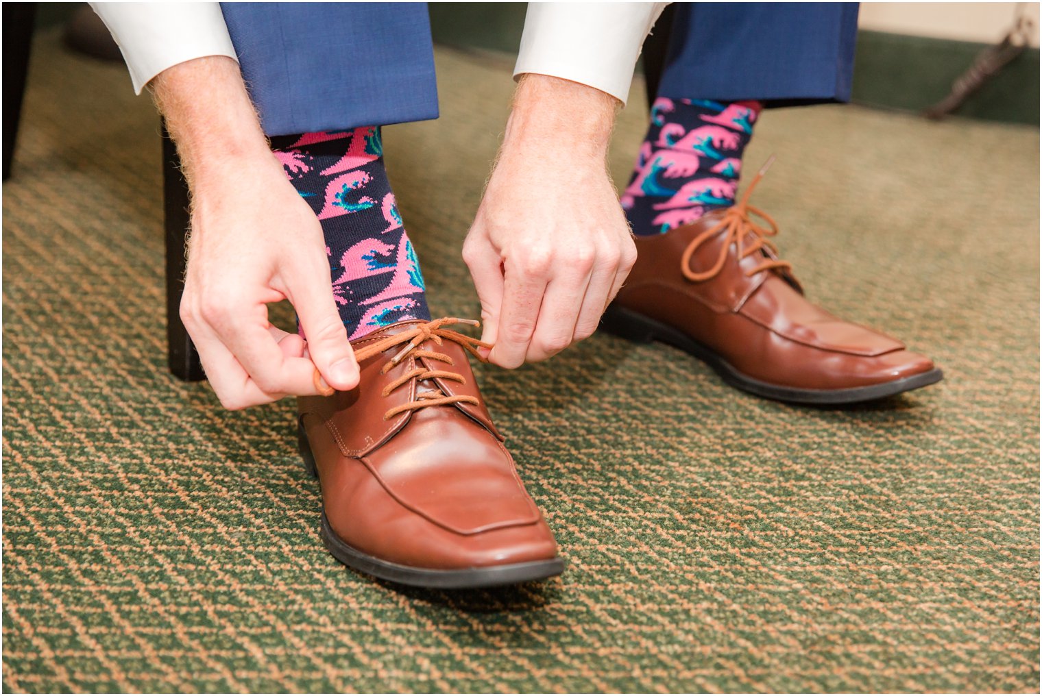 groom tying his shoes