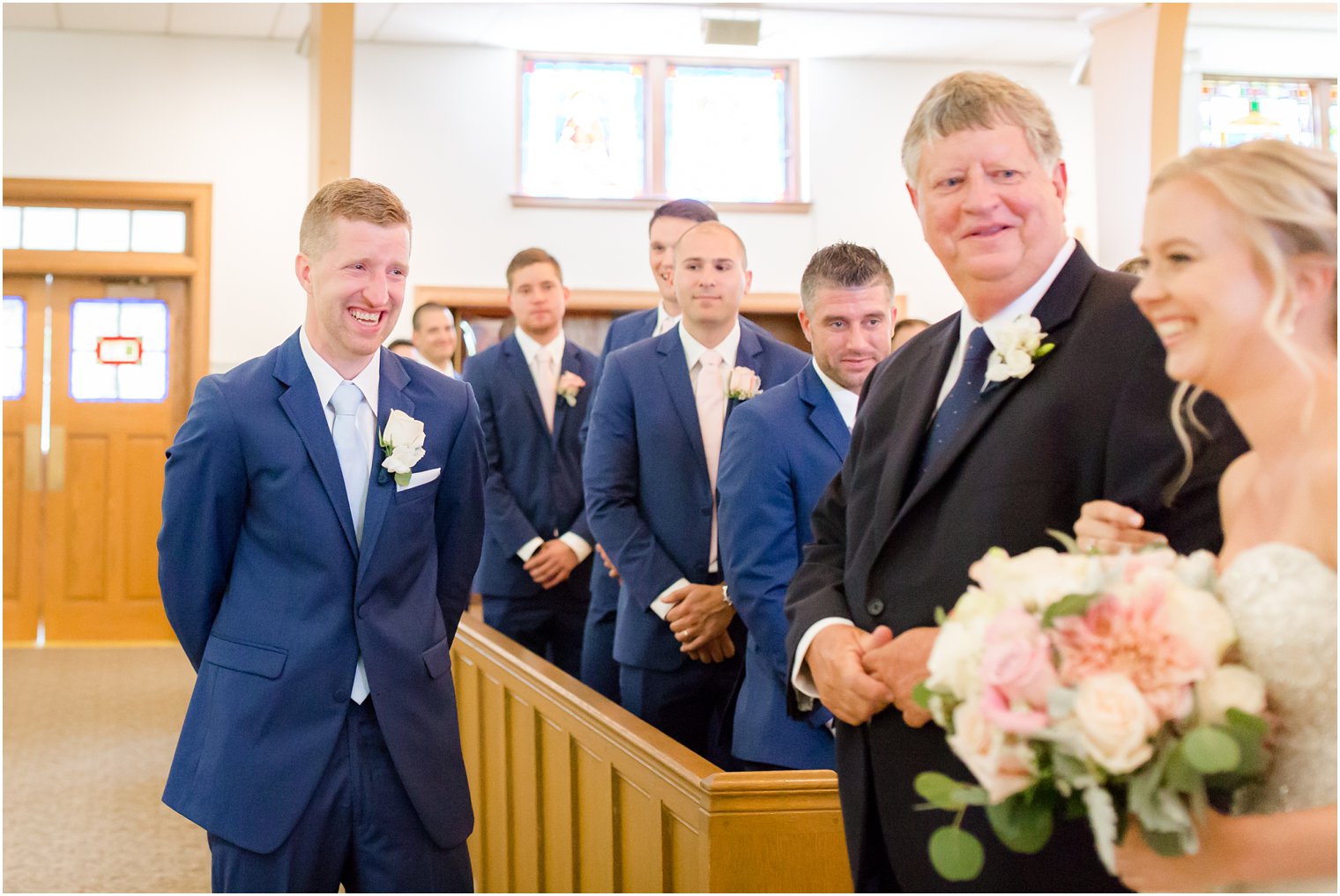 groom seeing his bride for the first time on her wedding day