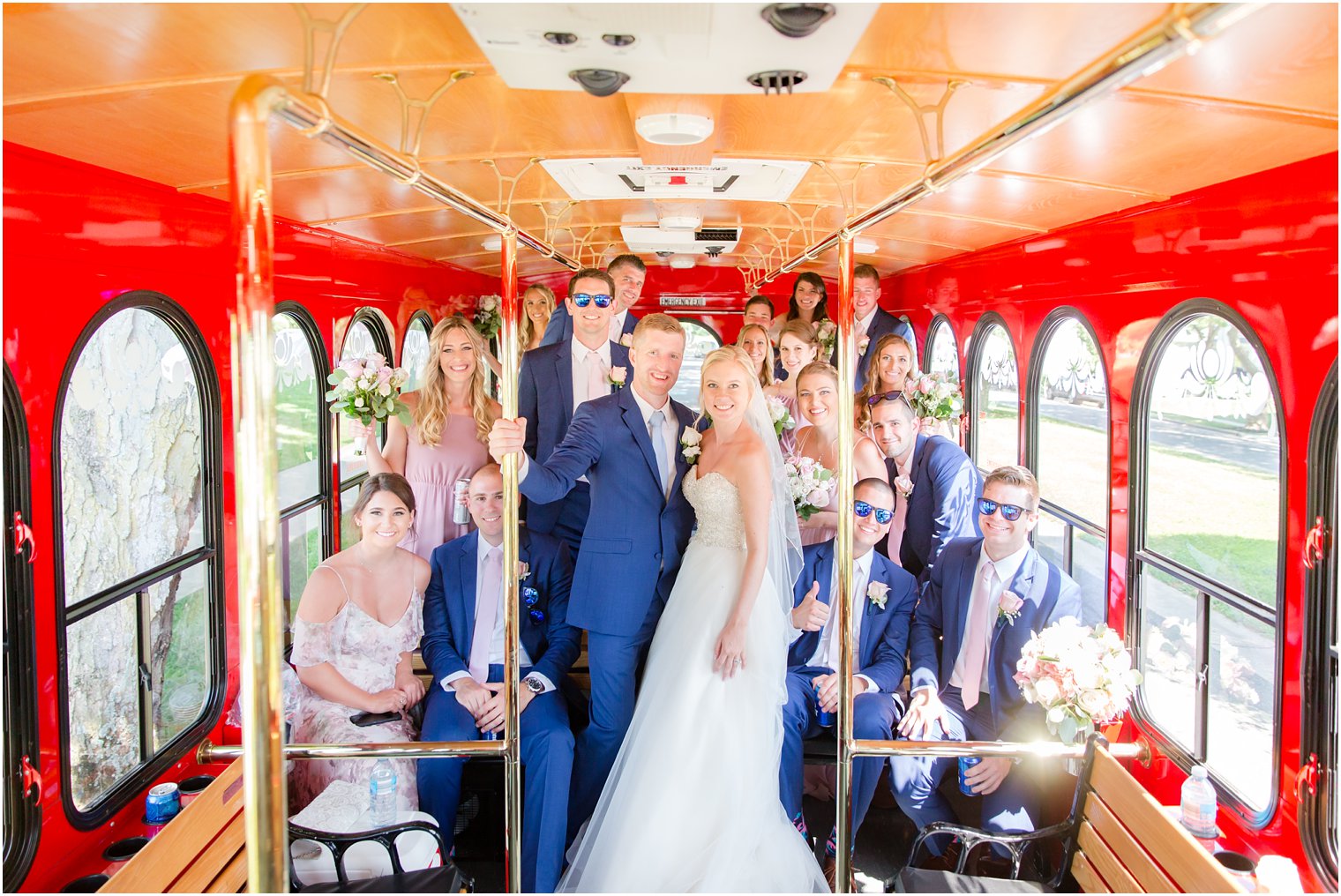bride and groom with bridal party in a Long Branch Trolley 