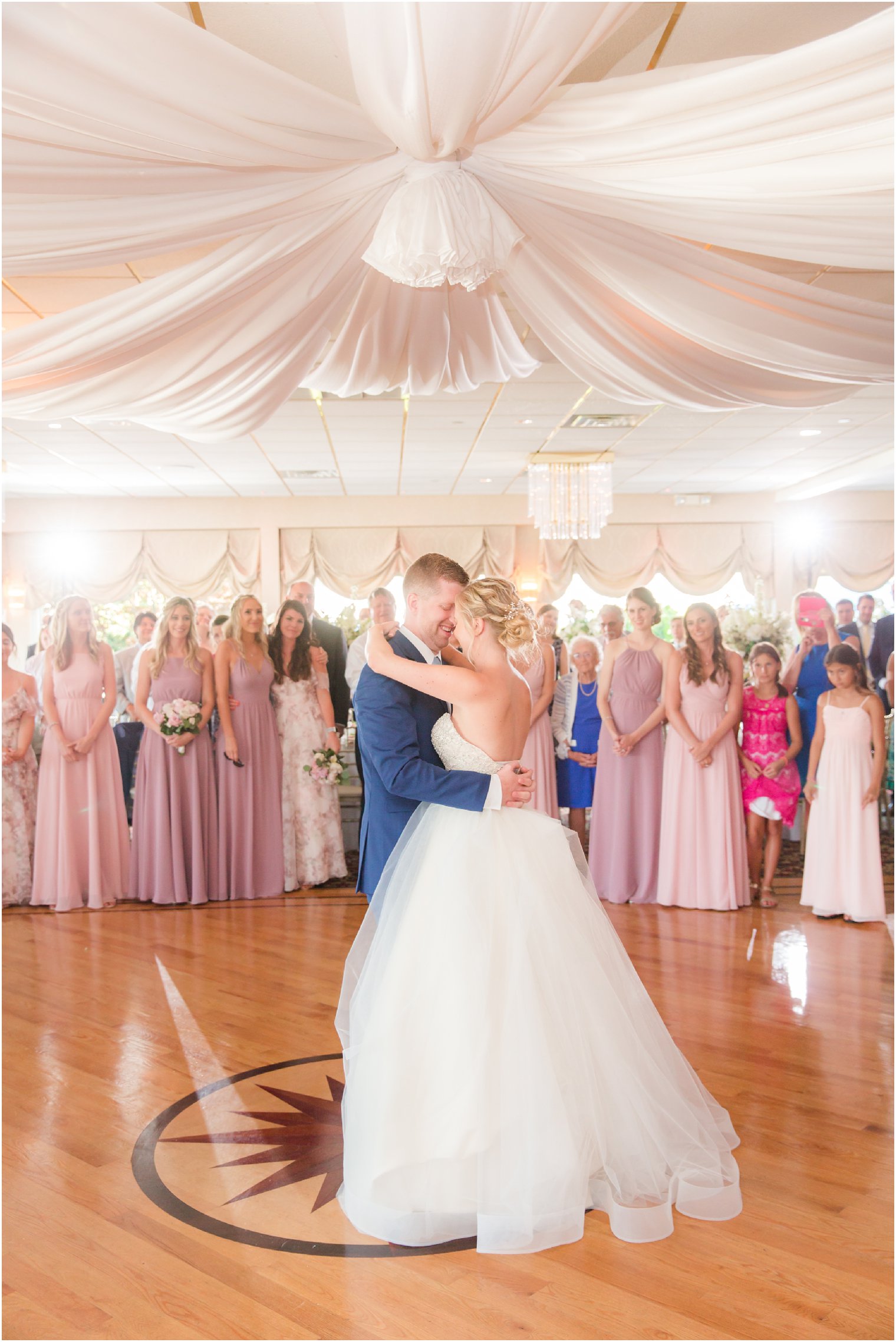 romantic photo of bride and groom dancing at Crystal Point Yacht Club