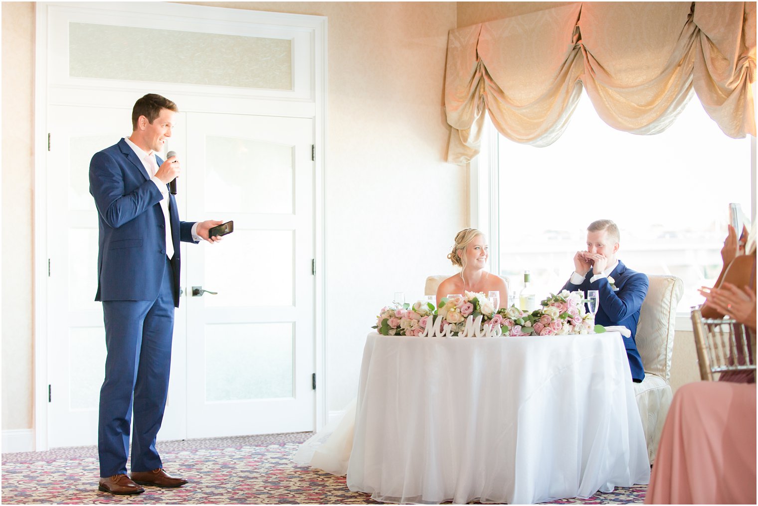 best man sharing toast at Crystal Point Yacht Club wedding