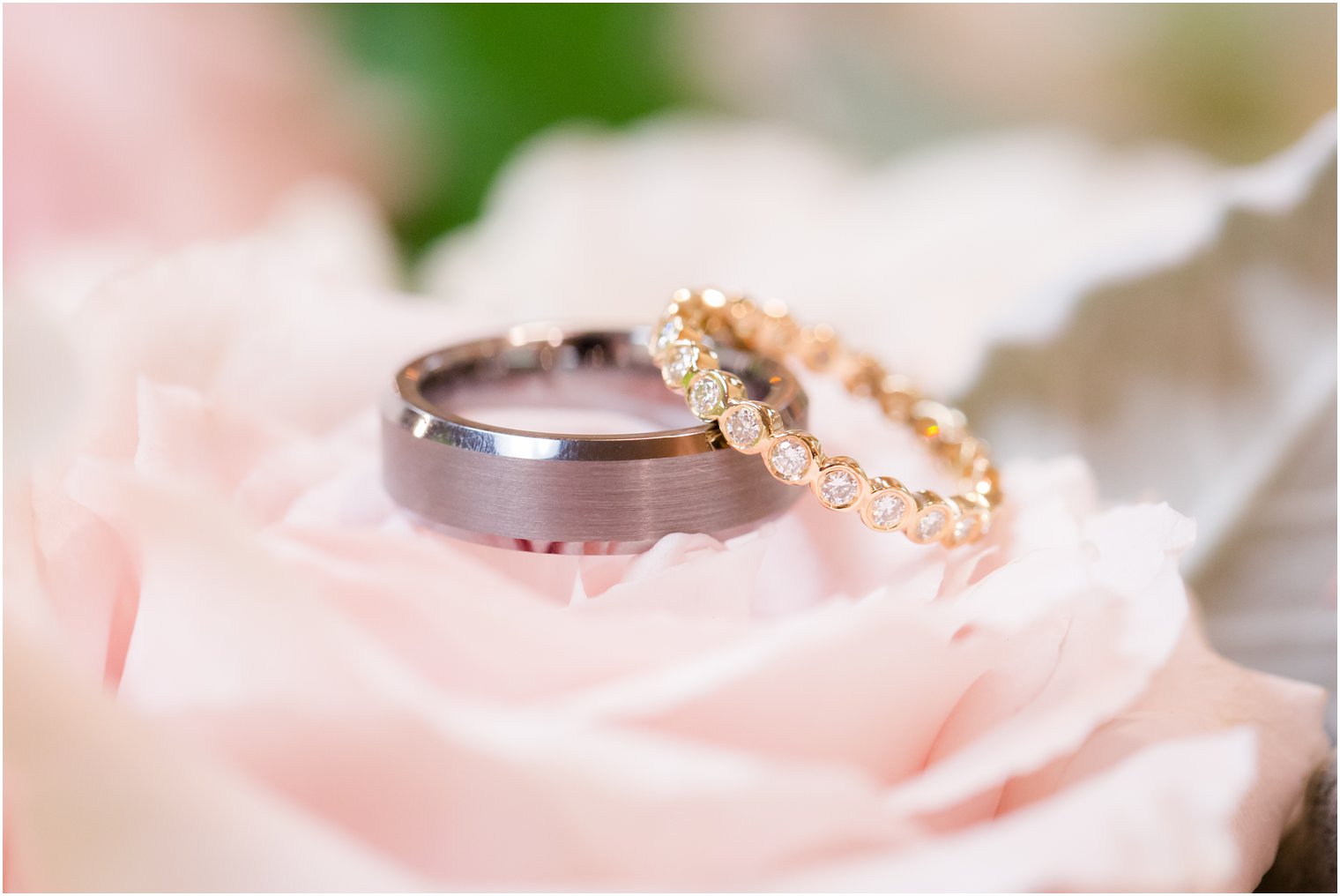 wedding bands on flowers