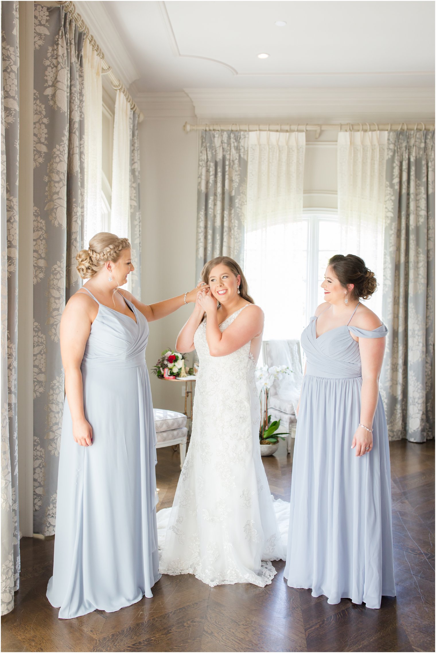 bride getting ready with maids of honor