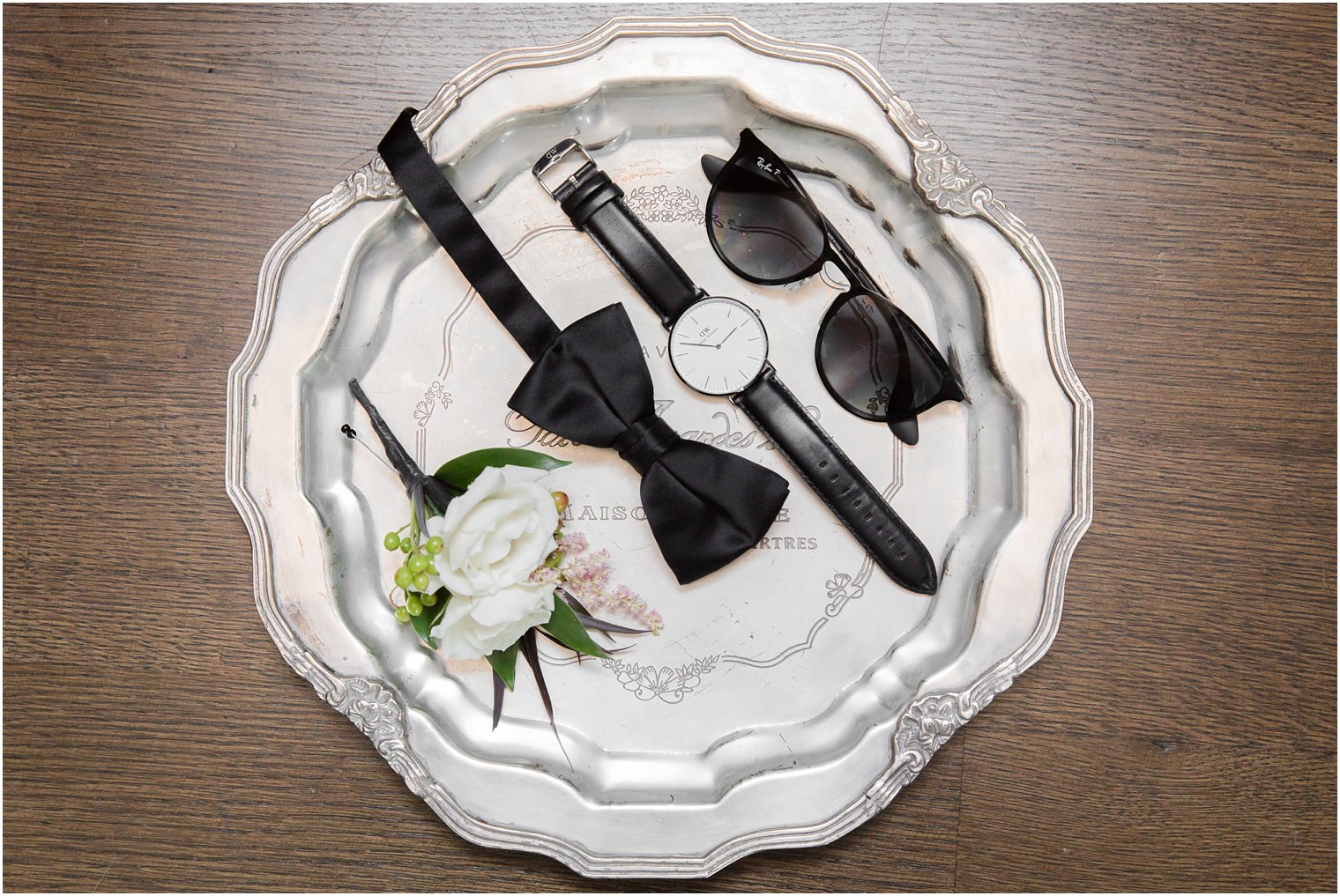 elegant groom details on a silver platter