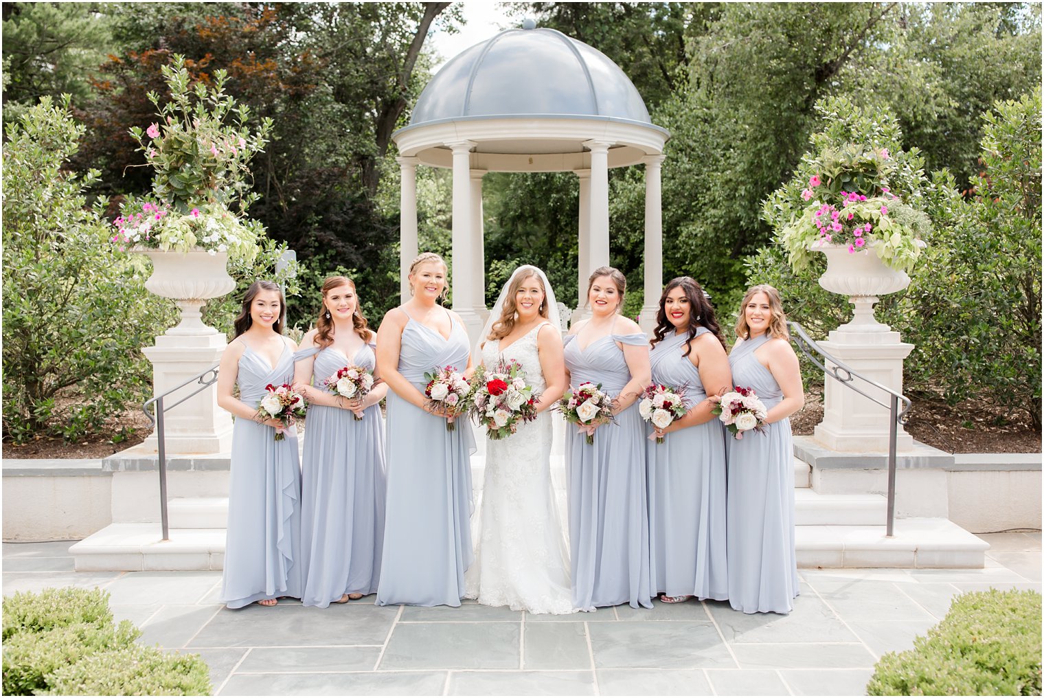 bride and bridesmaids in gardens at Park Chateau
