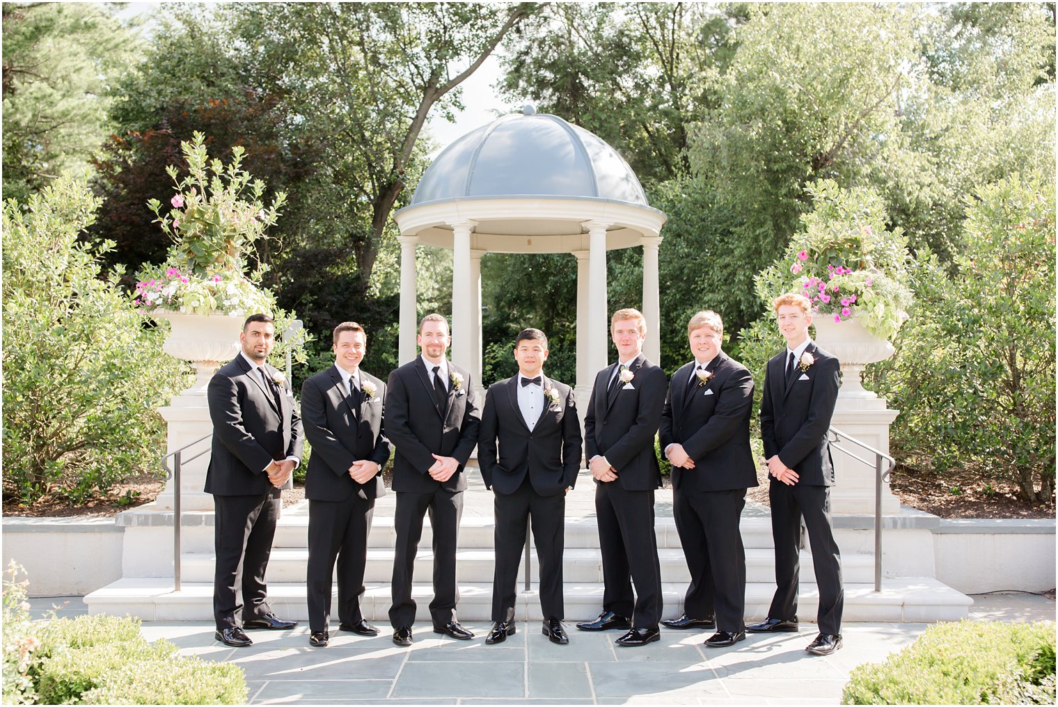 groomsmen wearing black suits 