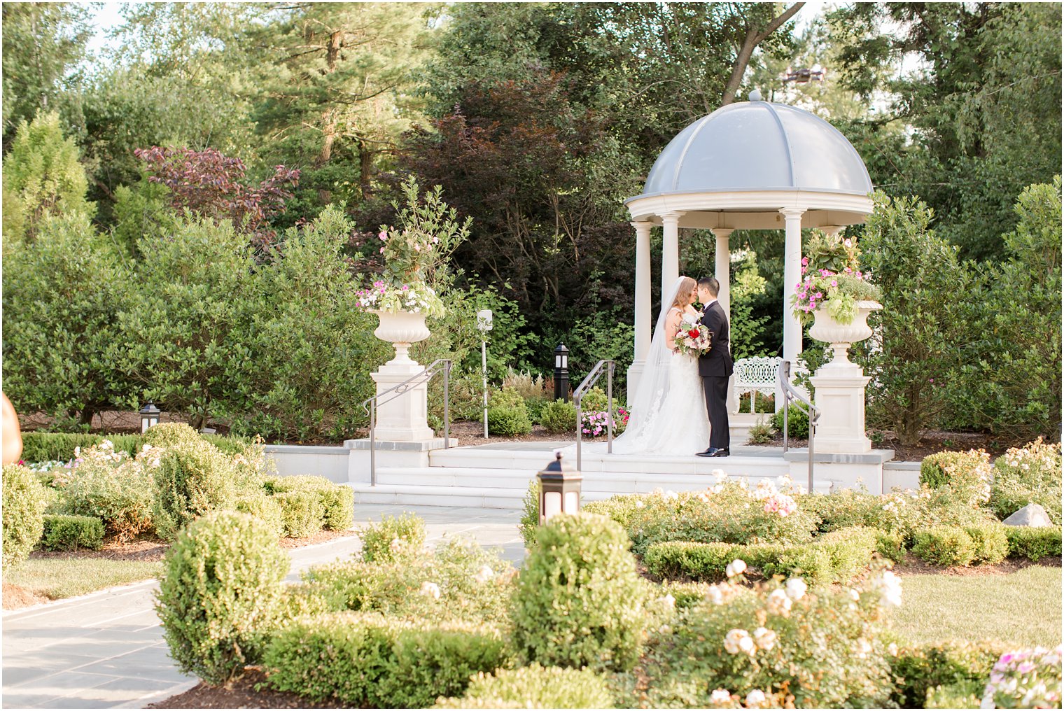 Bride and groom portrait in gardens at Park Chateau