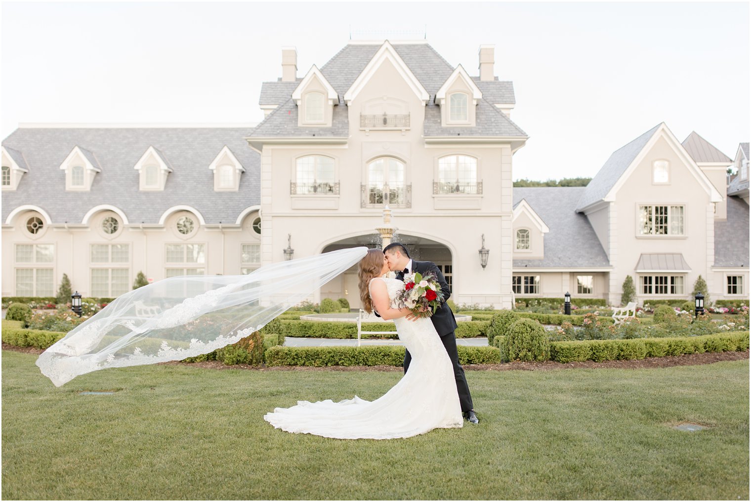 bride and groom flying veil photo