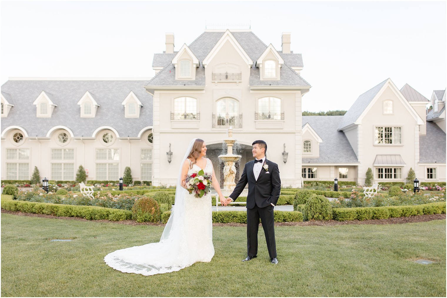 Elegant photo of bride and groom in front of Park Chateau
