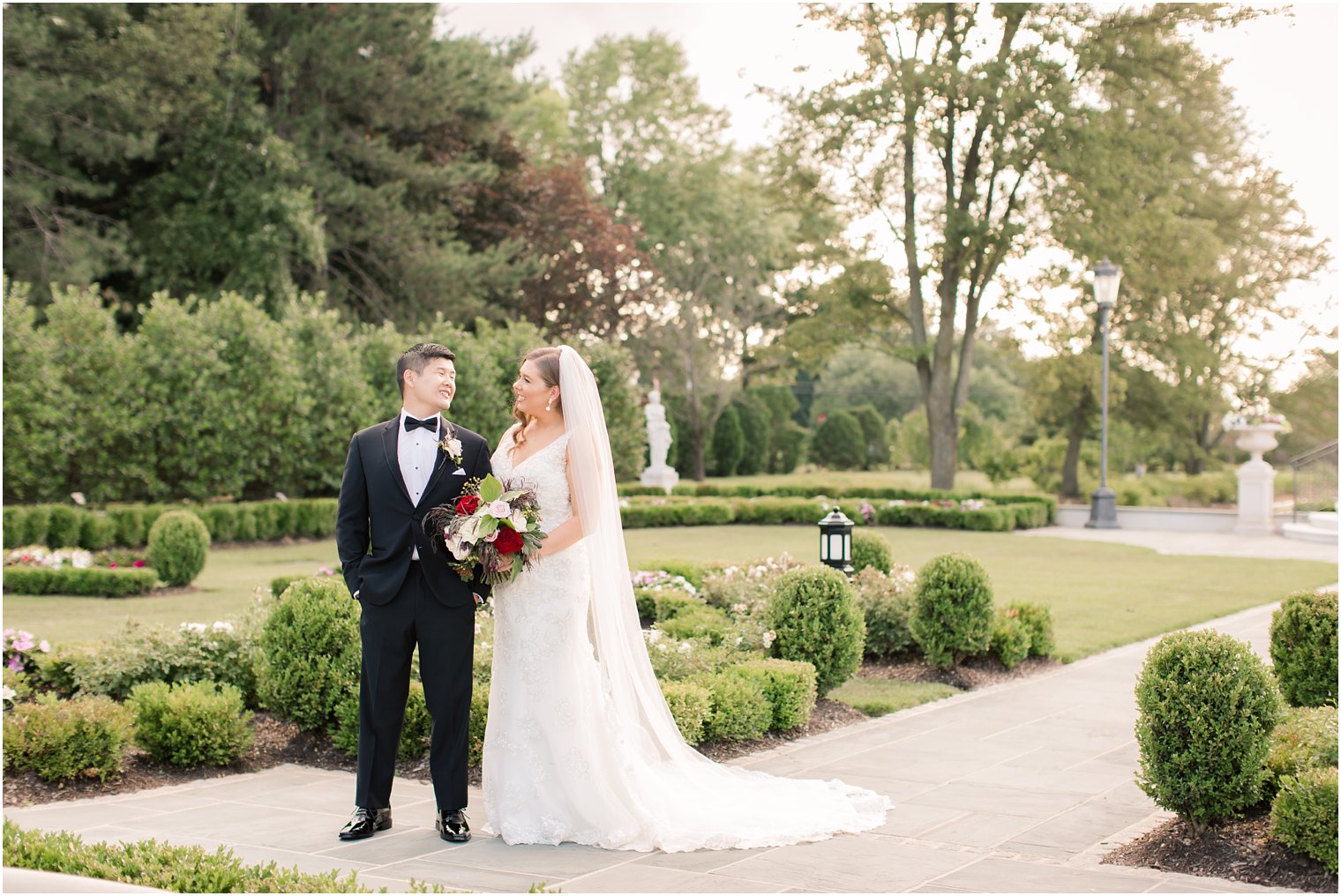 bride and groom smiling at each other