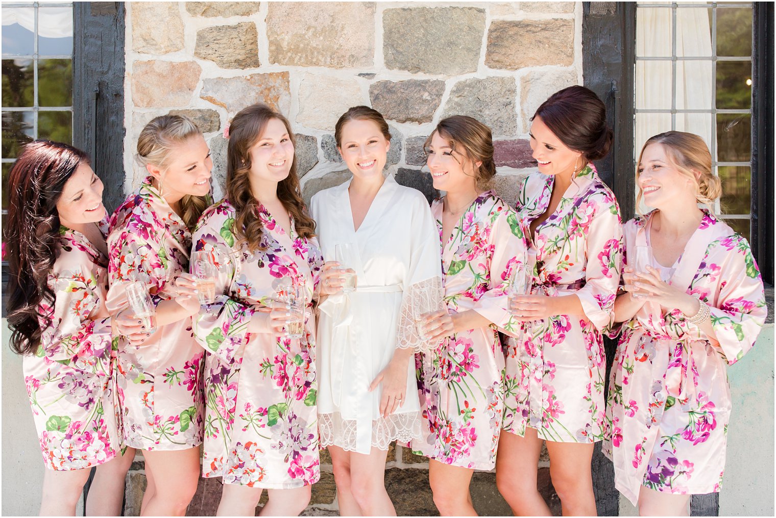 bride and bridesmaids in floral robes