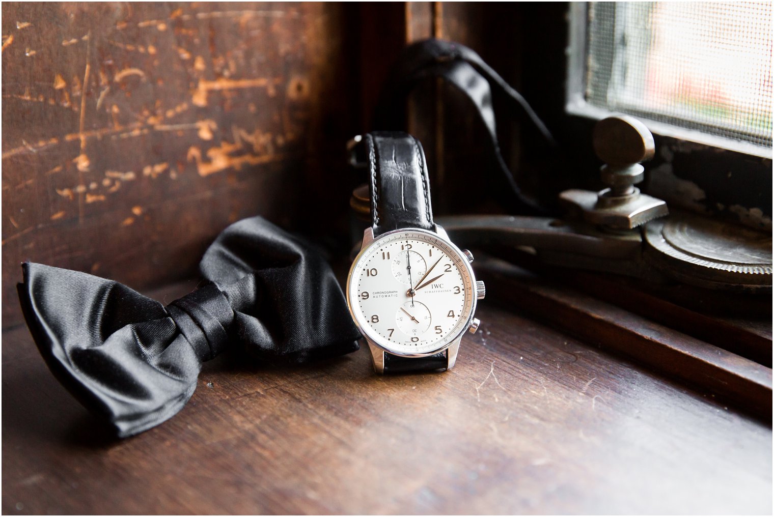 groom's watch and bowtie