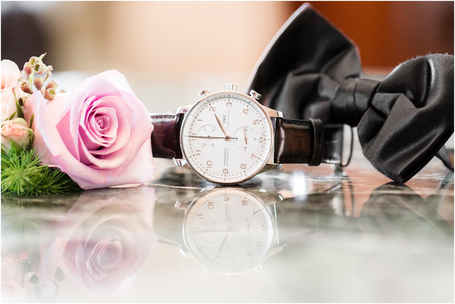 groom's watch and bow tie for black tie wedding
