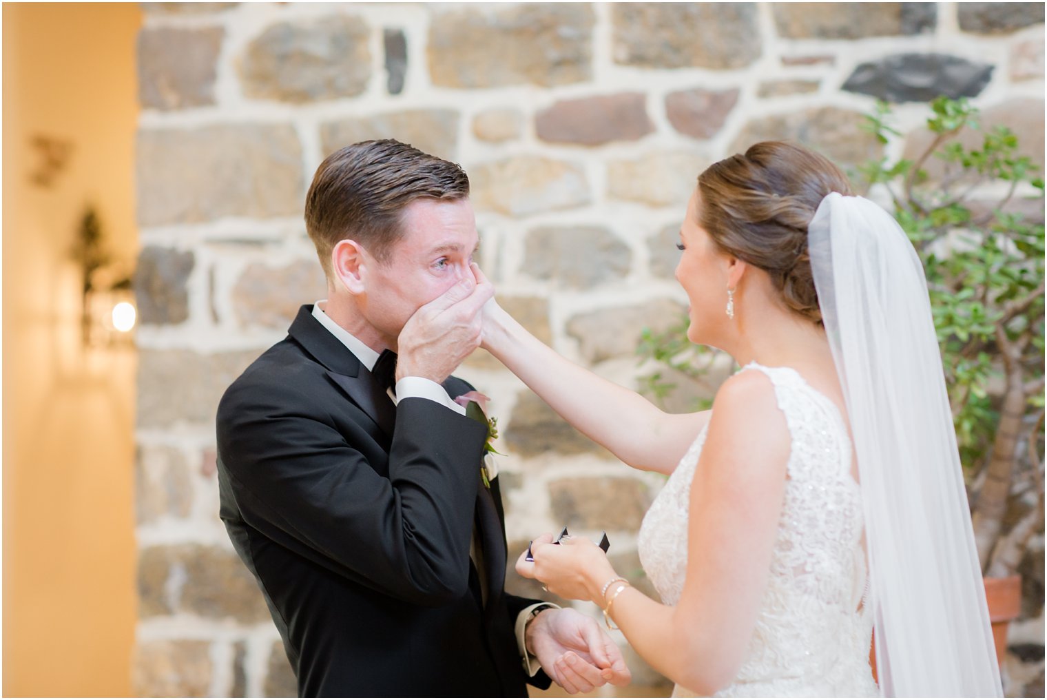 groom crying after first look