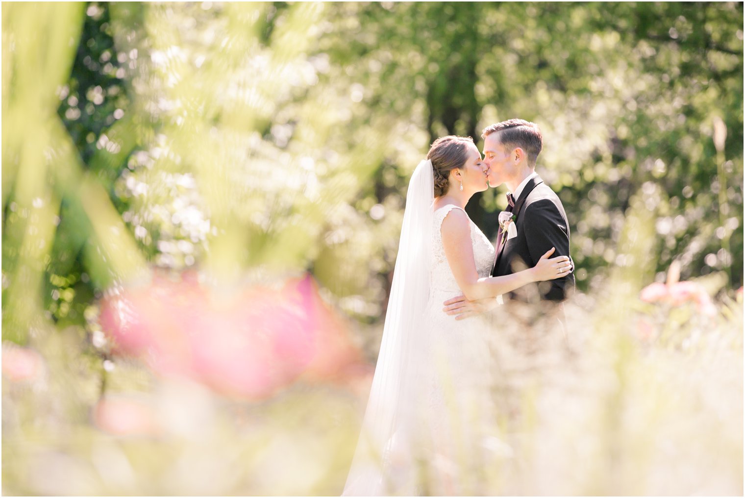 dreamy photo of bride and groom in garden