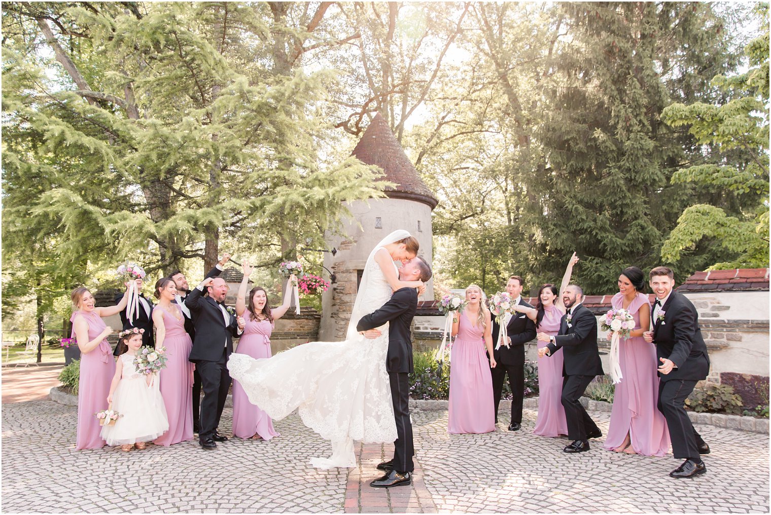 bridal party cheering for bride and groom 