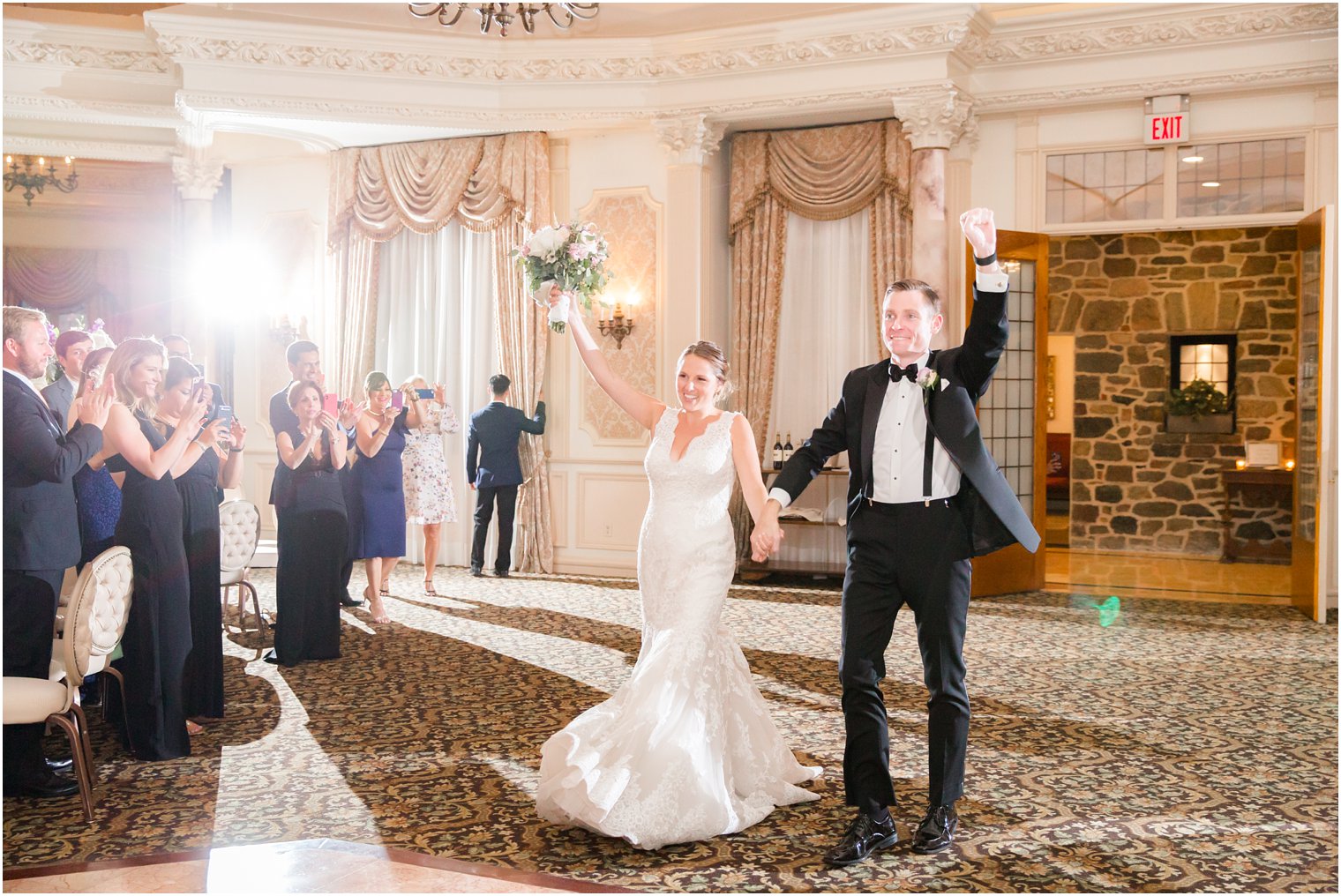 bride and groom entering their wedding reception 