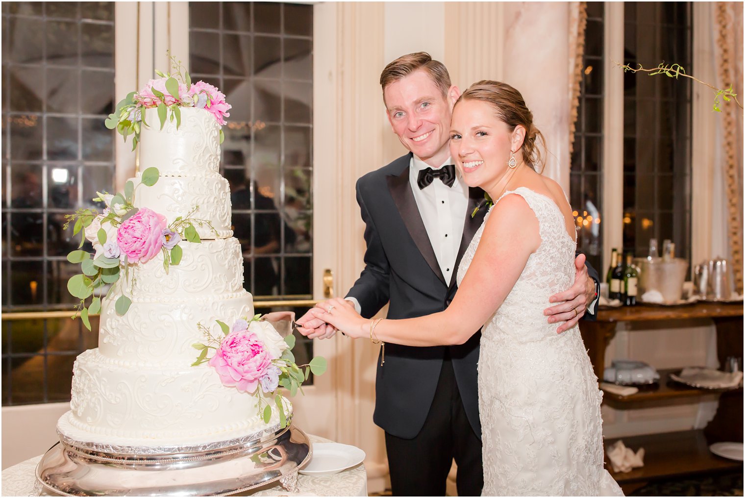 cutting their wedding cake at Pleasantdale Chateau