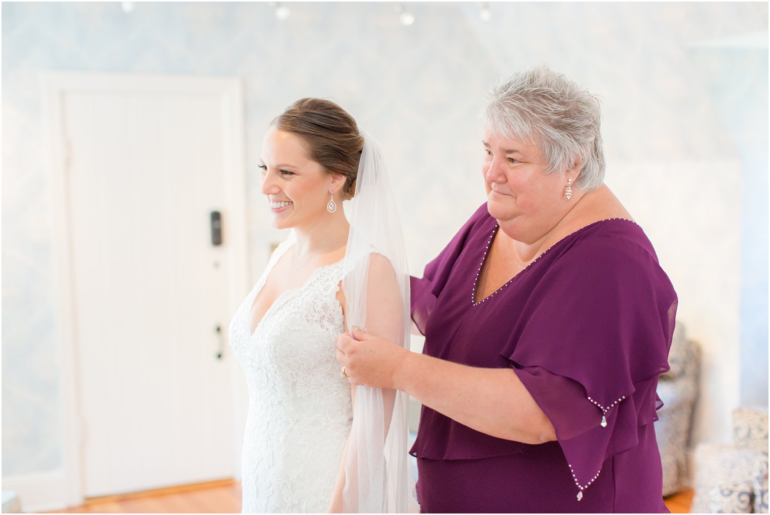 bride getting ready with her mother