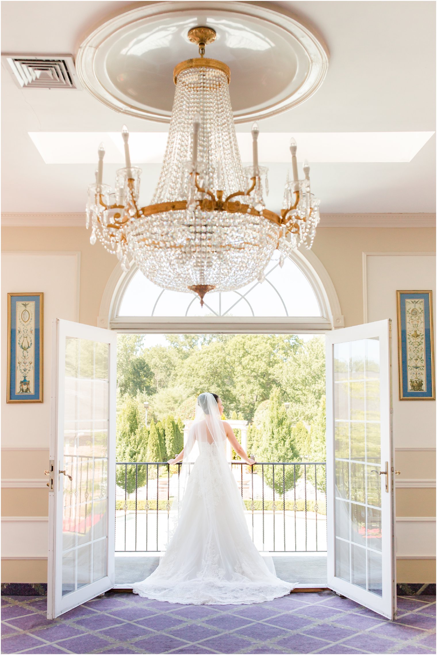 Bride look out into garden on her wedding day at Rockleigh Country Club