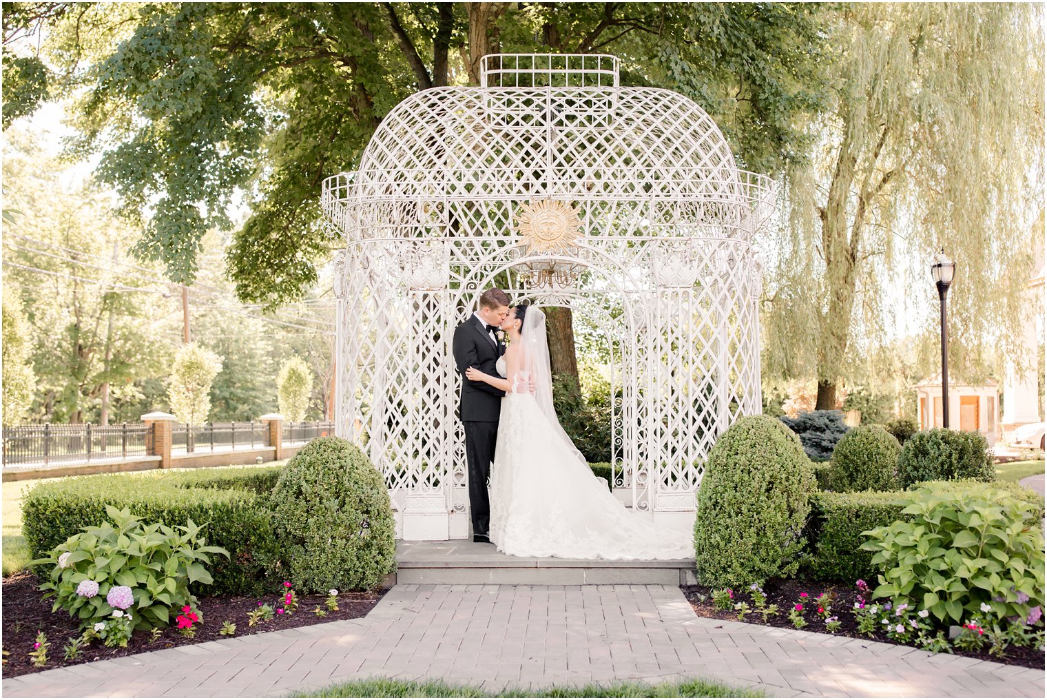 bride and groom kissing in gazebo at Rockleigh Country Club