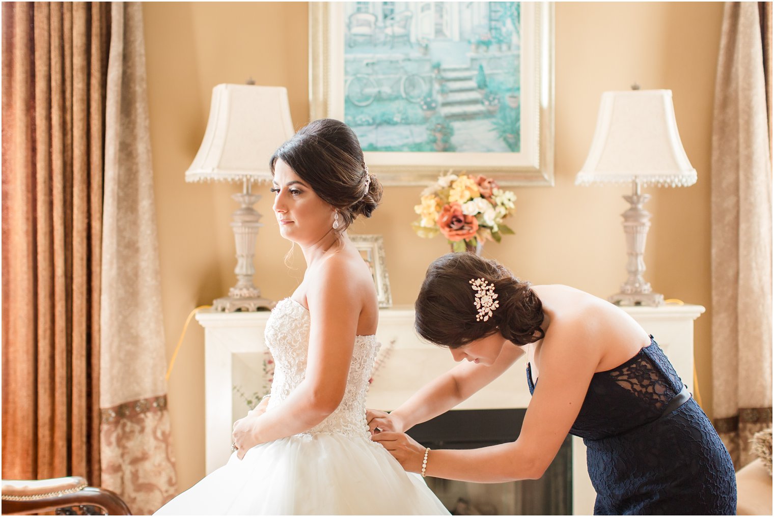 Bride getting ready with her maid of honor