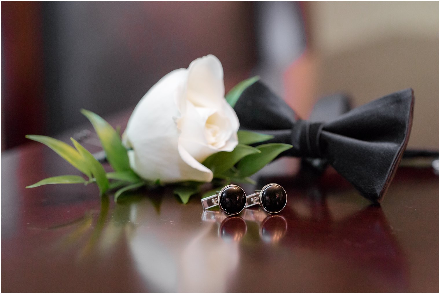 black bow tie and boutonniere