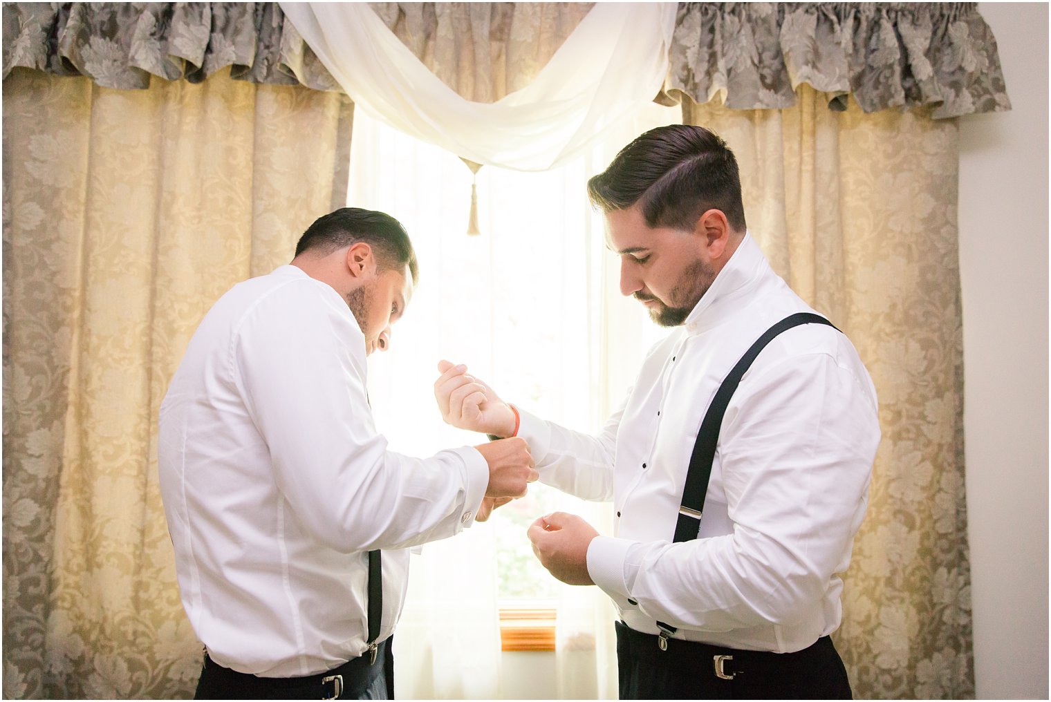 groom getting ready with his best man