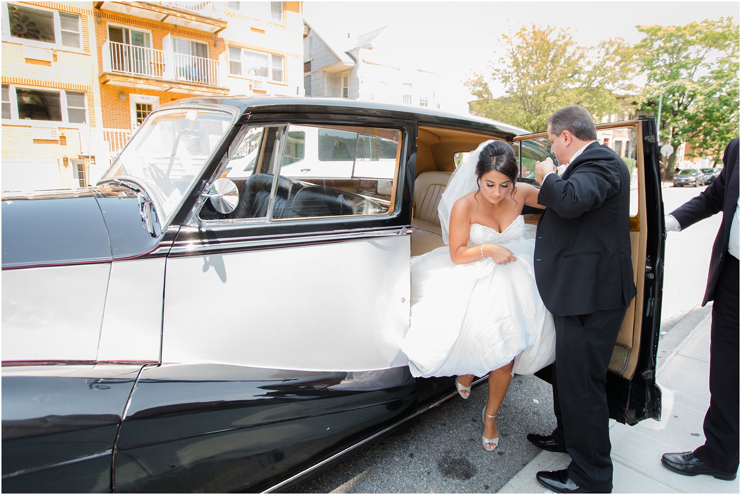 bride arriving in a classic car to her wedding ceremony at St. Finbar Catholic Church