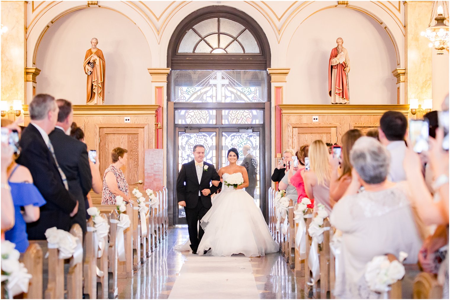 Bride processing with her father at St. Finbar Catholic Church