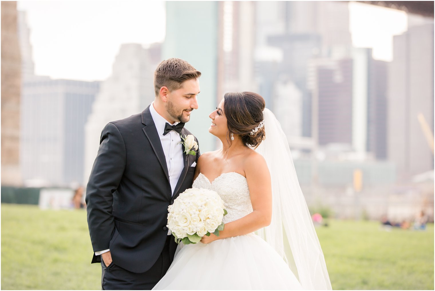 Candid photo of bride and groom at DUMBO