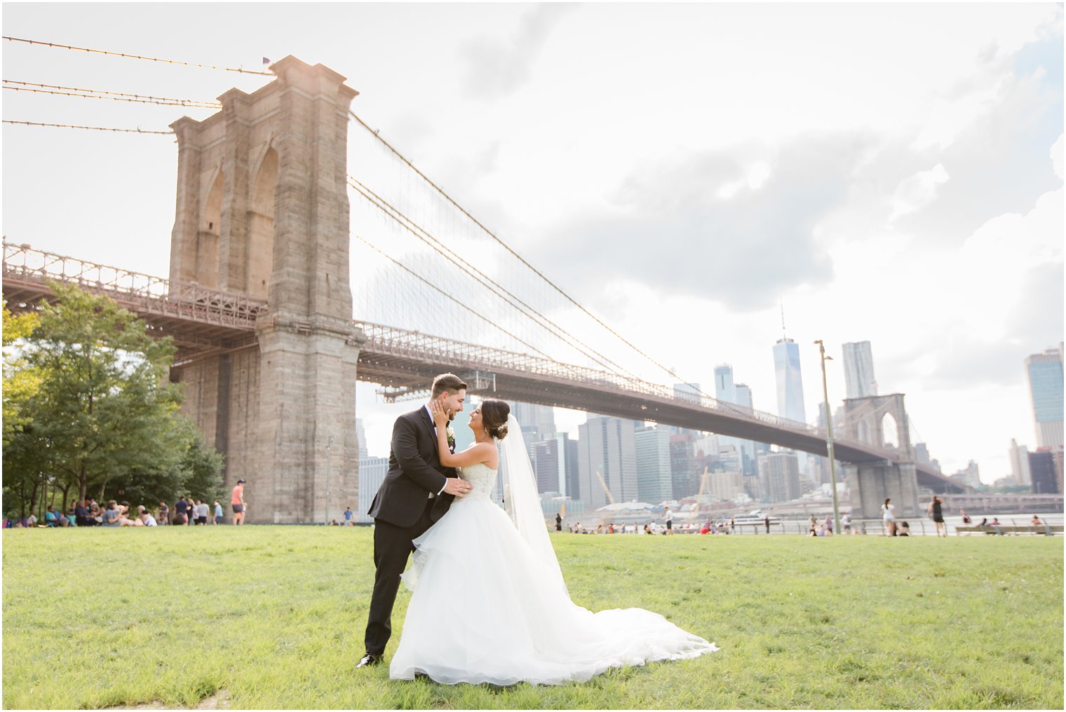Bride and groom on wedding day at Brooklyn Bridge