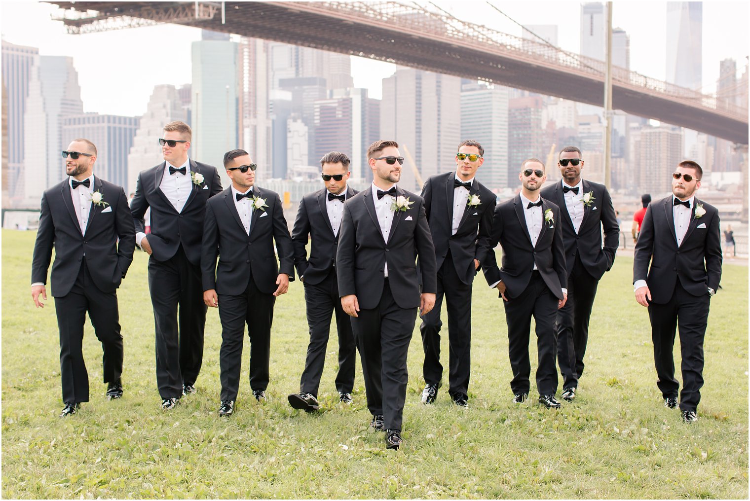 Groomsmen walking wearing sunglasses