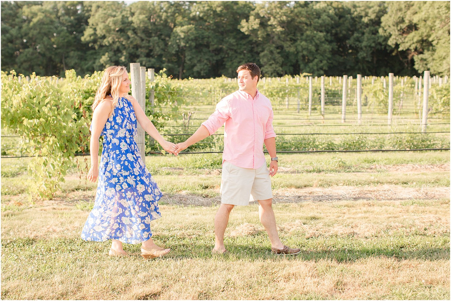Couple walks together at New Egypt NJ Laurita Winery during engagement session