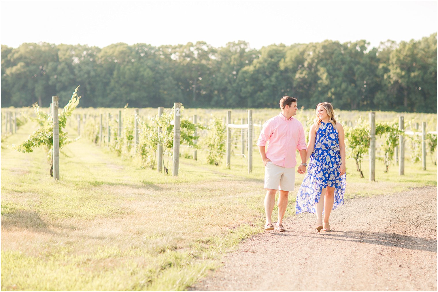 Couple walking in driveway at Laurita Winery in New Egypt NJ during engagement session