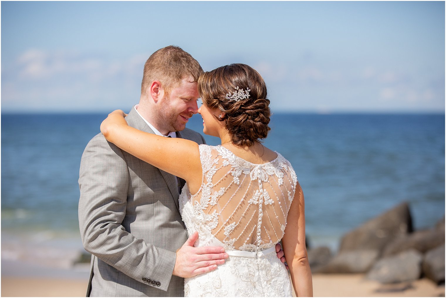lace details on Maggie Sottero dress photographed on beach at Ocean Place Resort and Spa