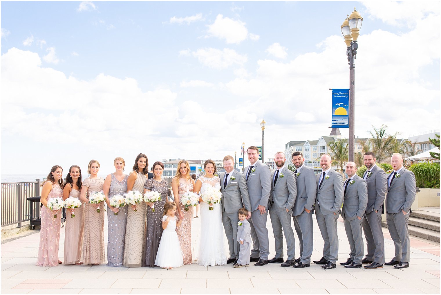 bridal party portrait on boardwalk in Long Branch NJ by Idalia Photography