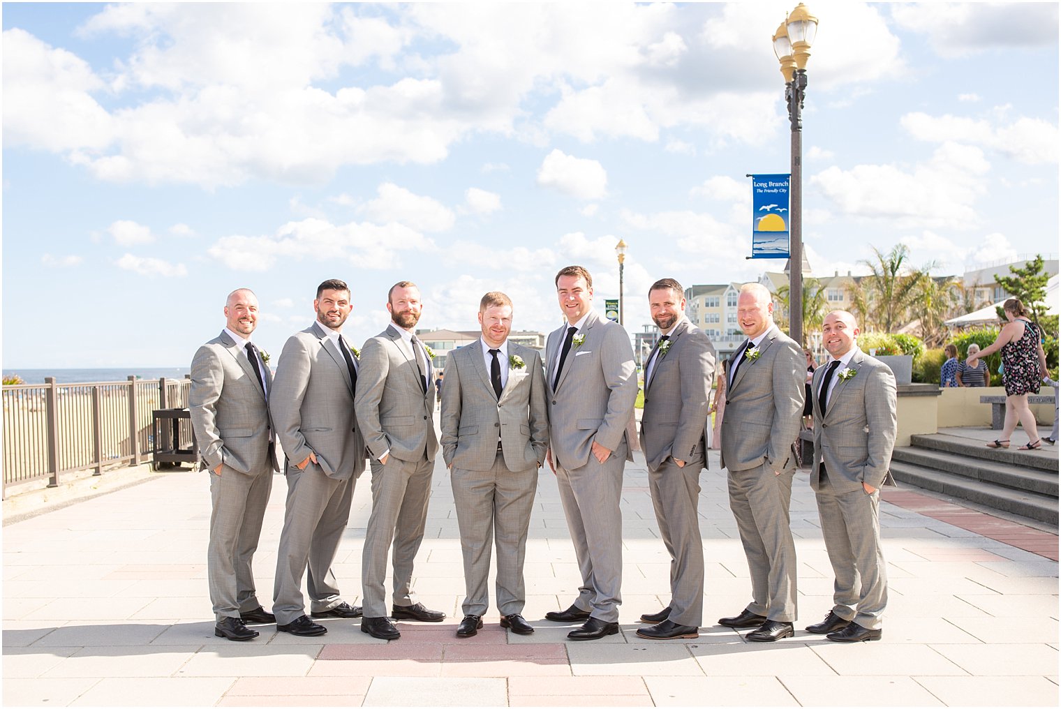 groom and groomsmen in Calvin Klein grey suits in Long Branch, NJ photographed by Idalia Photography