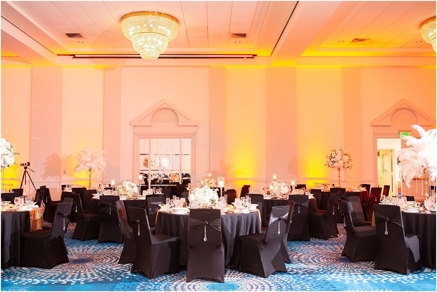 ballroom reception at Ocean Place Resort and Spa with black chair covers and white details
