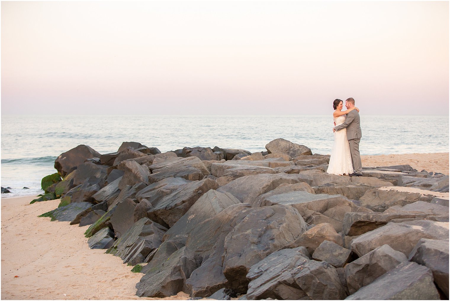 beach portrait on rocks at Ocean Place Resort and Spa by Idalia Photography