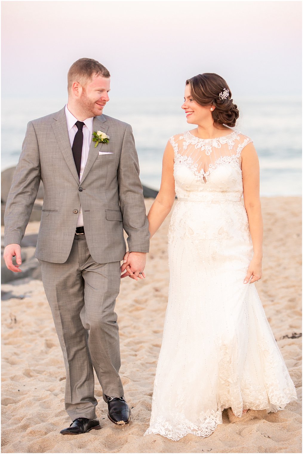 bride and groom smile at each other during wedding portraits at Ocean Place Resort and Spa