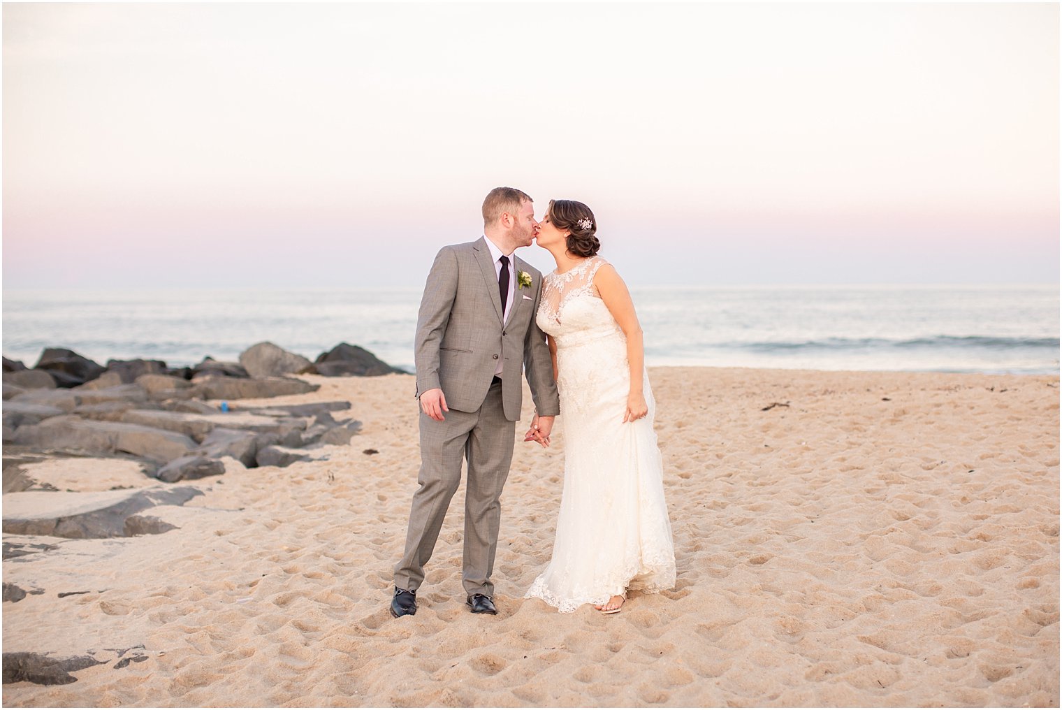 bride and groom kiss during sunset portraits at Ocean Place Resort and Spa in Long Branch NJ 