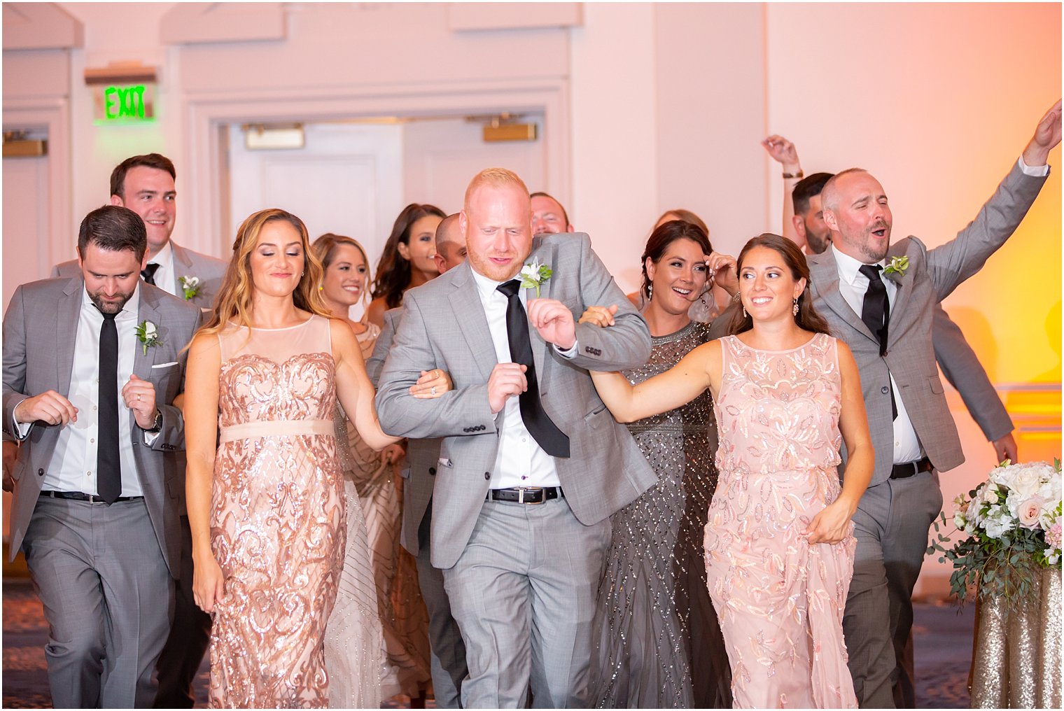 bridal party dancing into reception party photographed by Idalia Photography